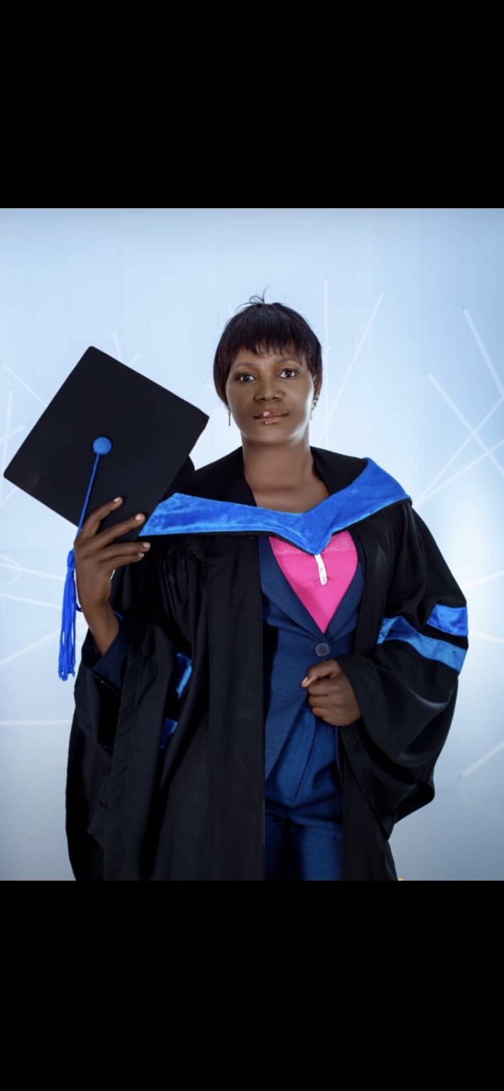 A postgraduate client in academic graduation dress